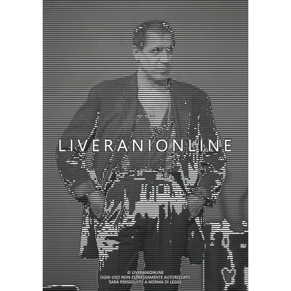 NEG-RETROSPETTIVA ADRIANO CELENTANO ATTORE CANTANTE  NELLA FOTO ADRIANO CELENTANO NELL\'ANNO 1991 NELLA TRASMISSIONE TELEVISIVA “NOTTE ROCK“  AG ALDO LIVERANI SAS 