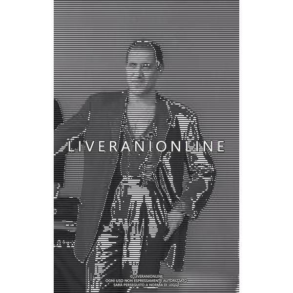NEG-RETROSPETTIVA ADRIANO CELENTANO ATTORE CANTANTE  NELLA FOTO ADRIANO CELENTANO NELL\'ANNO 1991 NELLA TRASMISSIONE TELEVISIVA “NOTTE ROCK“  AG ALDO LIVERANI SAS 