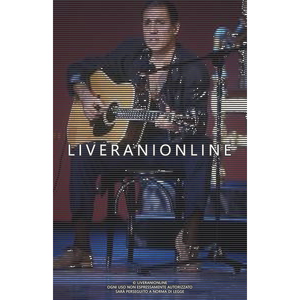 DIAP-RETROSPETTIVA ADRIANO CELENTANO ATTORE CANTANTE  NELLA FOTO ADRIANO CELENTANO NELL\'ANNO 1991 NELLA TRASMISSIONE TELEVISIVA “NOTTE ROCK“  AG ALDO LIVERANI SAS 
