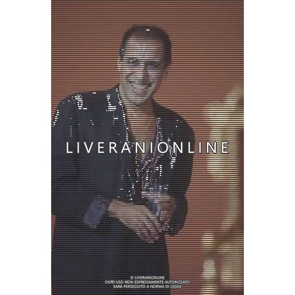 DIAP-RETROSPETTIVA ADRIANO CELENTANO ATTORE CANTANTE  NELLA FOTO ADRIANO CELENTANO NELL\'ANNO 1991 NELLA TRASMISSIONE TELEVISIVA “NOTTE ROCK“  AG ALDO LIVERANI SAS 
