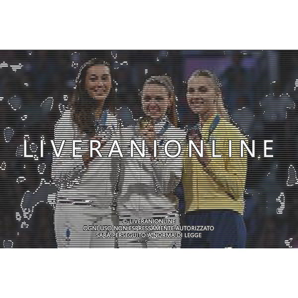 Olimpiadi Parigi 2024 - Scherma Sciabola F nella foto il podio, da SX Sara Balzer (FRA) seconda, Manon Apithy-Brunet (FRA) prima e Olga Kharlan (UKR) treza Parigi (FRA) 29-07-2024 Grand Palais Finale per la medaglia d\'oro della Sciabola femminile individuale foto Roberto Garavaglia/Agenzia Aldo Liverani sas