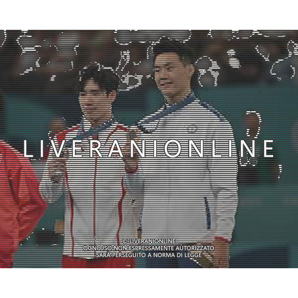 Olimpiadi Parigi 2024 - Ginnastica nella foto l\'atleta cinese Boheng Zhang (CHN) SX e quello di Taipei Chia-Hung Tang (TPE) insieme sul podio medaglia di bronzo a pari merito Parigi (FRA) 05-08-2024 Arena Bercy Ginnastica Artistica Finale sbarra maschile foto Roberto Garavaglia/Agenzia Aldo Liverani sas