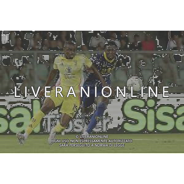 Pierre Kalulu of Juventus FC competes for the ball with Faride Alidou of Hellas Verona FC during Hellas Verona FC vs Juventus FC, 2° Serie A Enilive 2024-25 game at Marcantonio Bentegodi Stadium in Verona (VR), Italy, on August 26, 2024. (Photo by Davide Casentini)/ AGENZIA ALDO LIVERANI SAS