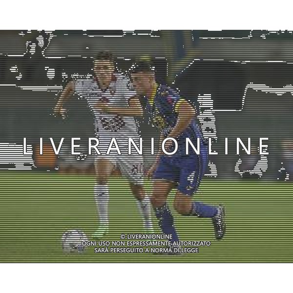 Flavius Daniliuc of Hellas Verona competes for the ball with Gvidas Gineitis of Torino FC during Hellas Verona FC vs Torino FC , 5° Serie A Enilive 2024-25 game at Marcantonio Bentegodi Stadium in Verona (VR), Italy, on September 20, 2024. (Photo by Davide Casentini)/AGENZIA ALDO LIVERANI SAS