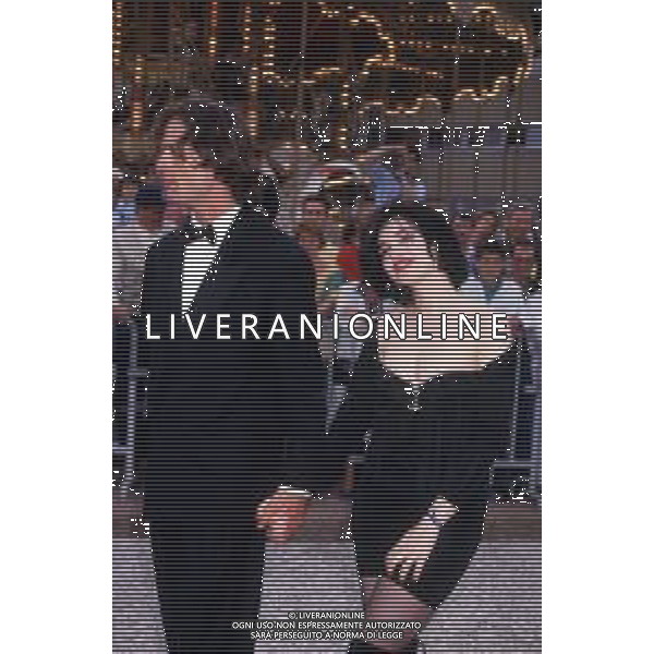 DIAP-RETROSPETTIVA RUPERT EVERETT ATTORE NELLA FOTO RUPERT EVERETT E BEATRICE DALLE A CANNES NELL\'ANNO 1988 AG ALDO LIVERANI SAS
