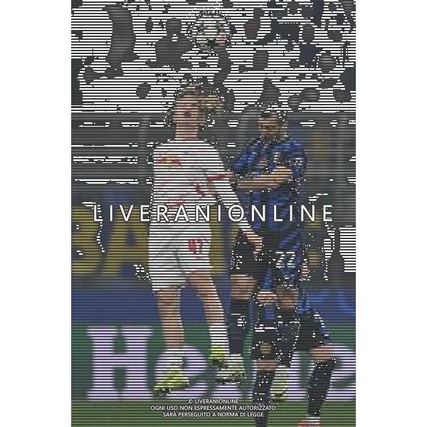 Inter vs Lipsia nella foto Viggo Gebel (Lipsia) e Henrikh Mkhitaryan (Inter) Milano 26-11-2024 Stadio Giuseppe Meazza - San Siro UEFA Champions League fase a girone unico - 5a giornata foto Roberto Garavaglia/Agenzia Aldo Liverani sas