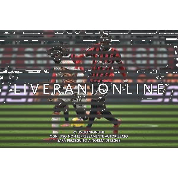 Milan vs Roma nella foto Manu Kouadio Koné (Roma) e Tammy Abraham (Milan) Milano 05-02-2025 Stadio Giuseppe Meazza - San Siro Coppa Italia Frecciarossa - quarti di finale foto Roberto Garavaglia/Agenzia Aldo Liverani sas- AGENZIA ALDO LIVERANI SAS