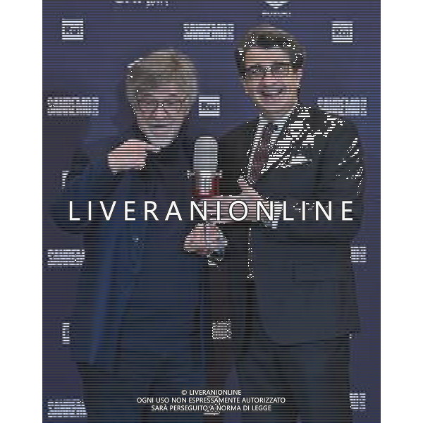 Festival Sanremo 2025 nella foto il maestro Giuseppe Pinuccio Pirazzoli SX riceve il premio di Assomusica dal presidente Carlo Parodi DX 75mo Festival della Canzone Italiana - Seconda Serata Teatro Ariston - Sanremo (IM) 12-02-2025 foto Roberto Garavaglia/agenzia Aldo Liverani sas