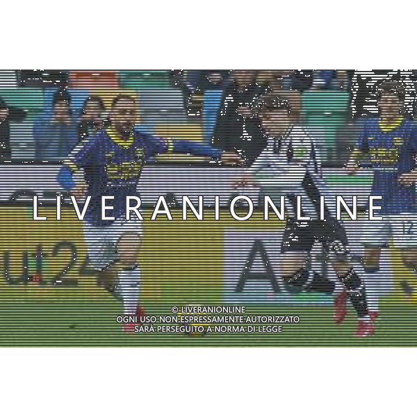 Grigoris Kastanos of Hellas Verona FC competes for the ball with Simone Pafundi of Udinese FC during Udinese Calcio vs Hellas Verona FC, 29° Serie A Enilive 2024-25 game at Bluenergy stadium in Udine (UD), Italy, on March 15, 2025. (Photo by Davide Casentini)- AGENZIA ALDO LIVERANI SAS