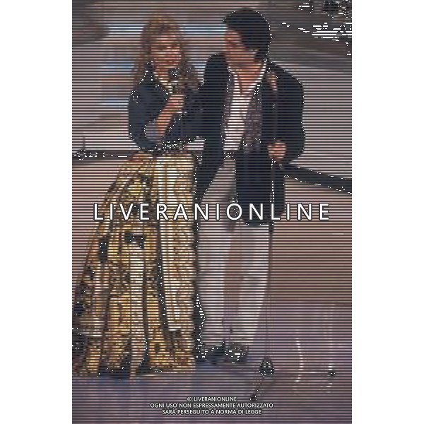 DIAP-RETROSPETTIVA BARBARA BOUCHET ATTRICE NELLA FOTO BARBARA BOUCHET CON MASSIMO MODUGNO A SANREMO NELL\'ANNO 1992 AG ALDO LIVERANI SAS