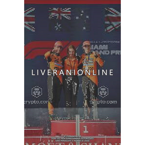 (L to R): Second placed Lando Norris (GBR) McLaren on the podium with Louise McEwen (GBR) McLaren Chief Marketing Officer and race winner Oscar Piastri (AUS) McLaren. 04.05.2025. Formula 1 World Championship, Rd 6, Miami Grand Prix, Miami, Florida, USA, Race Day. - www.xpbimages.com, EMail: requests@xpbimages.com © Copyright: Moy / XPB Images ONLY ITALY-AG ALDO LIVERANI SAS