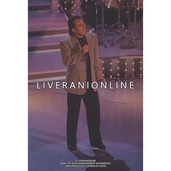 DIAP-RETROSPETTIVA ALBANO CARRISI CANTANTE NELLA FOTO ALBANO CARRISI AL FESTIVAL DI SANREMO NELL\'ANNO 1996 AG ALDO LIVERANI SAS