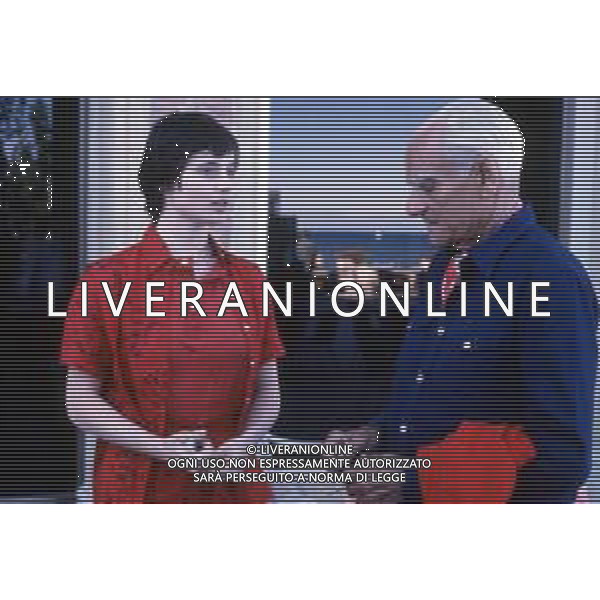DIAP-RETROSPETTIVA ALBERTO MORAVIA SCRITTORE NELLA FOTO ALBERTO MORAVIA A VENEZIA NLL\'ANNO 1979 CON ISABELLA ROSSELLINI AG ALDO LIVERANI SAS 