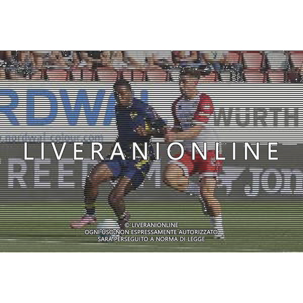 Jackson Tchatchoua of Hellas Verona FC battle for the ball with Federico Davi of FC Sudtirol during SudTirol vs Hellas Verona FC, 4° Test Match, at Druso stadium in Bolzano (BZ), on August 03, 2025. (Photo by Davide Casentini) AG ALDO LIVERANI SAS