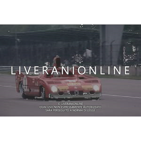 DIAP-RETROSPETTIVA MARIO ANDRETTI PILOTA NELLA FOTO MARIO ANDRETTI CON ALFA ROMEO AG ALDO LIVERANI SAS