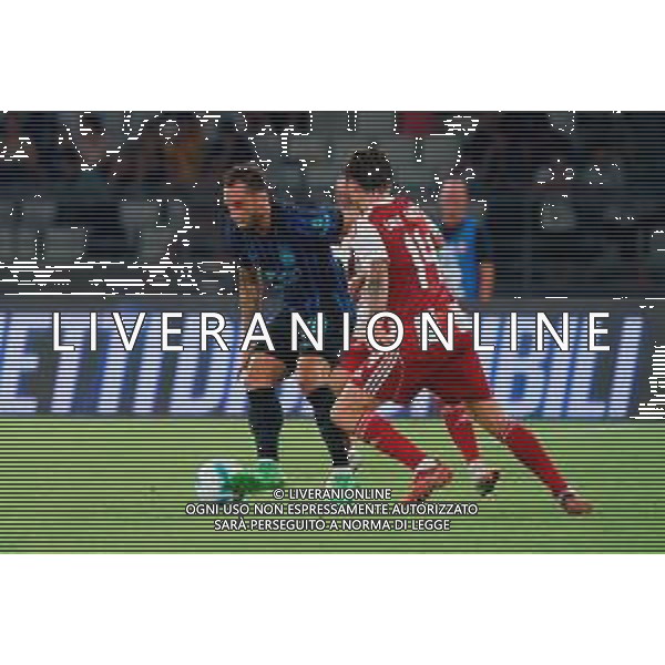 TVEM August 16, 2025 Bari, Italy - FC Inter vs Olympiacos FC - friendly match - San Nicola Stadium. In the pic: Hakan Calhanoglu of FC Inter in action against Daniel Garcia Carrillo of Olympiakos FC FOTO EMMANUELE MASTRODONATO-AG ALDO LIVERANI SAS