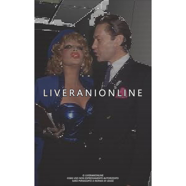 DIAP-RETROSPETTIVA ISABELLA BIAGINI ATTRICE NELLA FOTO ISABELLA BIAGINI NELL\'ANNO 1988 A MILANO CON HELMUT BERGER FOTO JAMES SAVOIA-AG ALDO LIVERANI SAS