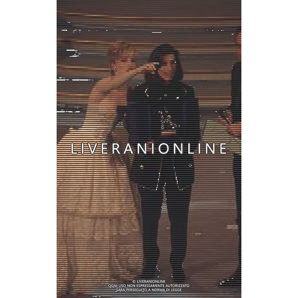 DIAP-RETROSPETTIVALAURA PAUSINI CANTANTE NELLA FOTO LAURA PAUSINI A SANREMO NELL\'ANNO 1993 CON PIPPO BAUDO E MILLY CARLUCCI AG ALDO LIVERANI SAS