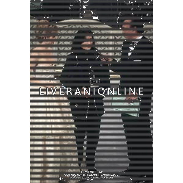 DIAP-RETROSPETTIVALAURA PAUSINI CANTANTE NELLA FOTO LAURA PAUSINI A SANREMO NELL\'ANNO 1993 CON PIPPO BAUDO E MILLY CARLUCCI AG ALDO LIVERANI SAS