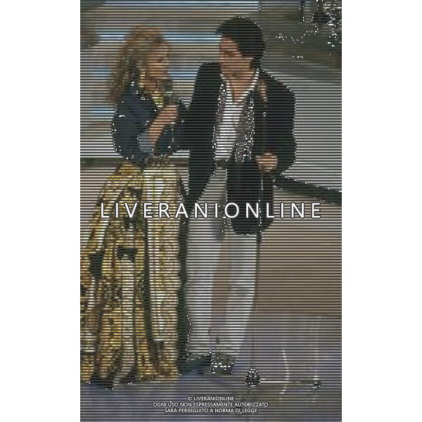 DIAP-RETROSPETTIVA MASSIMO MODUGNO CANTANTE NELLA FOTO MASSIMO MODUGNO A SANREMO NELL\'ANNO 1992 CON BARBARA BOUCHET AG ALDO LIVERANI SAS