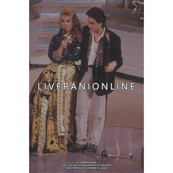 DIAP-RETROSPETTIVA MASSIMO MODUGNO CANTANTE NELLA FOTO MASSIMO MODUGNO A SANREMO NELL\'ANNO 1992 CON BARBARA BOUCHET AG ALDO LIVERANI SAS