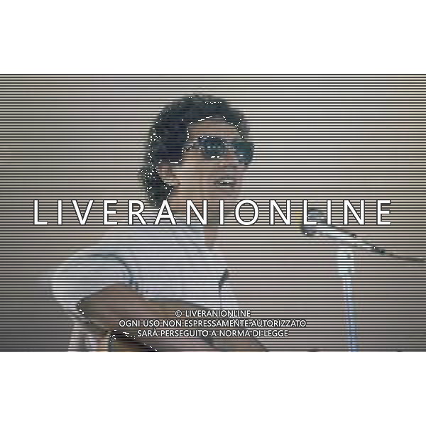 DIAP-RETROSPETTIIVA EUGENIO BENNATO CANTANTE NELLA FOTO EUGENIO BENNATO A RIVA DEL GARDA NELL\'ANNO 1987 AG ALDO LIVERANI SAS