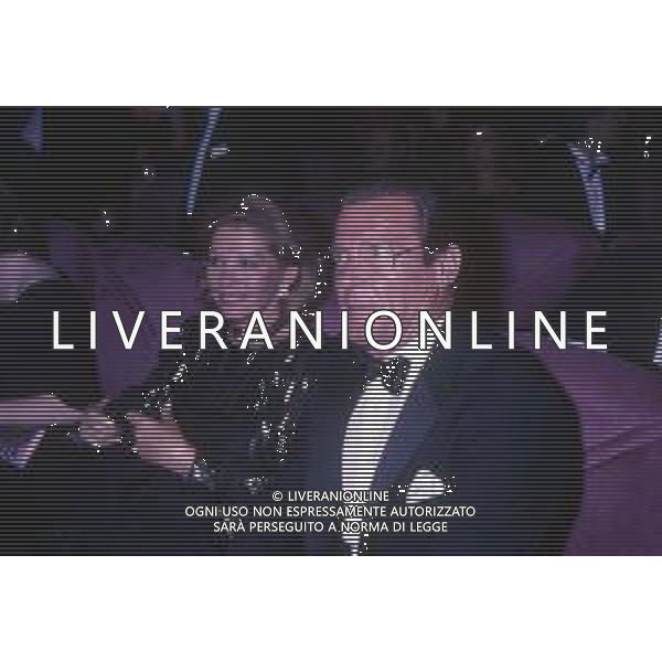 DIAP-RETROSPETTIVA ROGER MOORE ATTORE NELLA FOTO ROGER MOORE CON LA MOGLIE LUISA MATTIOLI A CANNES NELL\'ANNO 1989 AG ALDO LIVERANI SAS