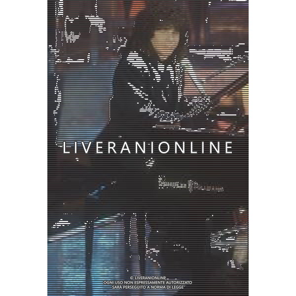 DIAP-RETROSPETTIVA RICCARDO COCCIANTE CANTANTE NELLA FOTO RICCARDO COCCIANTE AL FESTIVAL DI SANREMO NELL\'ANNO 1991 AG ALDO LIVERANI SAS