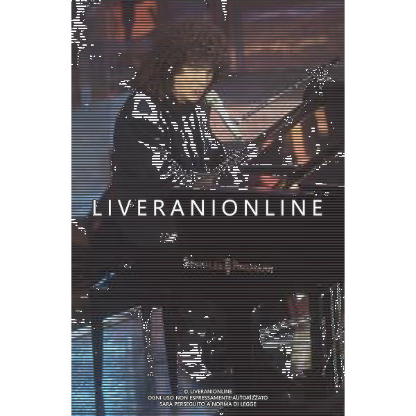 DIAP-RETROSPETTIVA RICCARDO COCCIANTE CANTANTE NELLA FOTO RICCARDO COCCIANTE AL FESTIVAL DI SANREMO NELL\'ANNO 1991 AG ALDO LIVERANI SAS