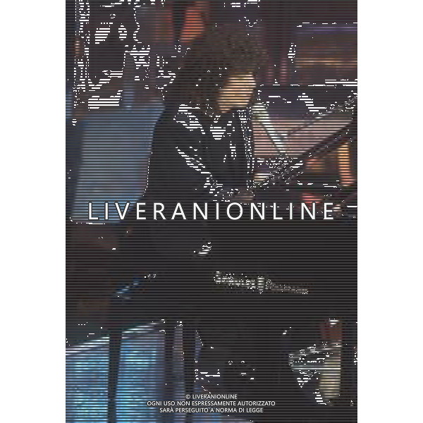 DIAP-RETROSPETTIVA RICCARDO COCCIANTE CANTANTE NELLA FOTO RICCARDO COCCIANTE AL FESTIVAL DI SANREMO NELL\'ANNO 1991 AG ALDO LIVERANI SAS
