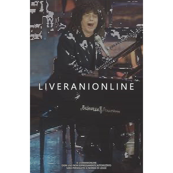 DIAP-RETROSPETTIVA RICCARDO COCCIANTE CANTANTE NELLA FOTO RICCARDO COCCIANTE AL FESTIVAL DI SANREMO NELL\'ANNO 1991 AG ALDO LIVERANI SAS