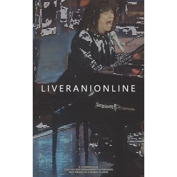 DIAP-RETROSPETTIVA RICCARDO COCCIANTE CANTANTE NELLA FOTO RICCARDO COCCIANTE AL FESTIVAL DI SANREMO NELL\'ANNO 1991 AG ALDO LIVERANI SAS