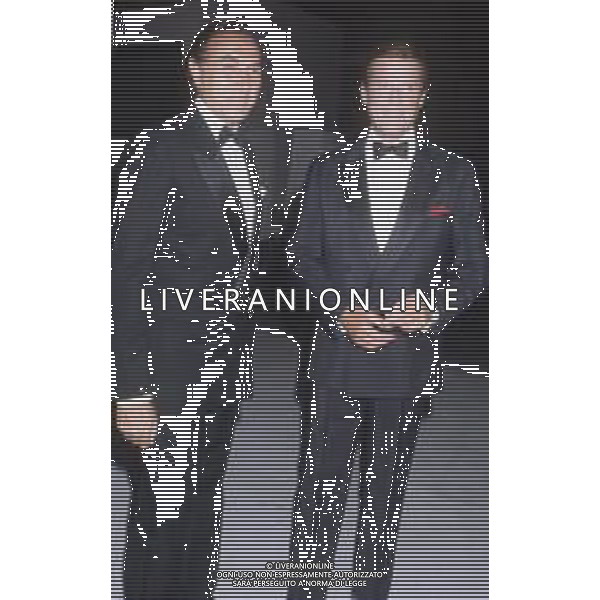 DIAP-RETROSPETTIVA ROGER MOORE ATTORE NELLA FOTO ROGER MOORE CON PIPPO BAUDO A ROMA NELL\'ANNO 1985 AG ALDO LIVERANI SAS