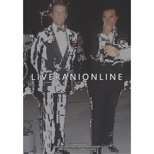 DIAP-RETROSPETTIVA ROGER MOORE ATTORE NELLA FOTO ROGER MOORE CON PIPPO BAUDO A ROMA NELL\'ANNO 1985 AG ALDO LIVERANI SAS