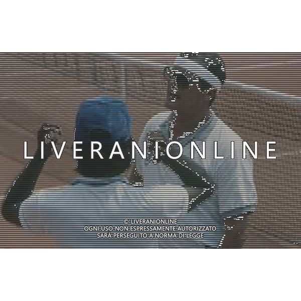 DIAP-RETROSPETTIVA ROGER MOORE ATTORE NELLA FOTO ROGER MOORE A MONTECARLO AL TORNEO DI TENNIS NELL\'ANNO 1988 AG ALDO LIVERANI SAS