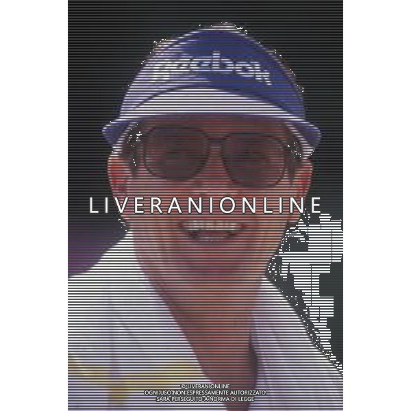 DIAP-RETROSPETTIVA ROGER MOORE ATTORE NELLA FOTO ROGER MOORE A MONTECARLO AL TORNEO DI TENNIS NELL\'ANNO 1988 AG ALDO LIVERANI SAS