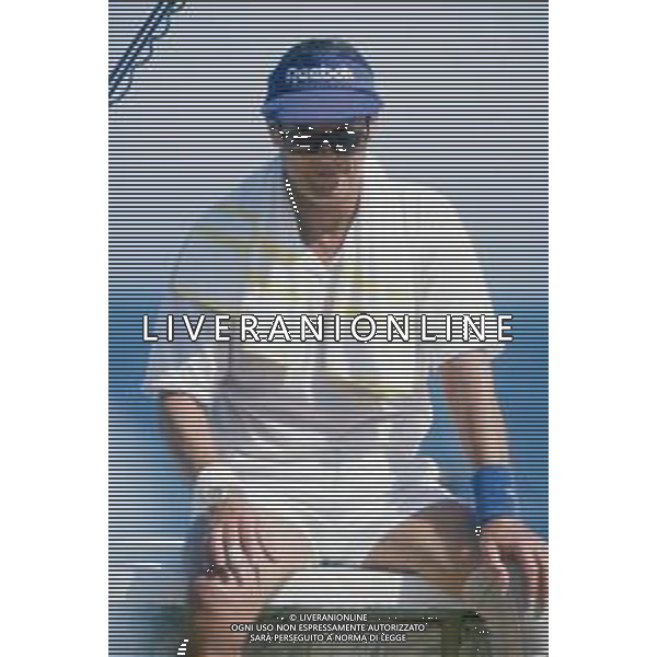 DIAP-RETROSPETTIVA ROGER MOORE ATTORE NELLA FOTO ROGER MOORE A MONTECARLO AL TORNEO DI TENNIS NELL\'ANNO 1988 AG ALDO LIVERANI SAS