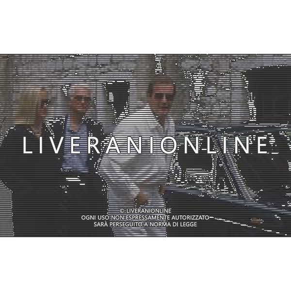 DIAP-RETROSPETTIVA ROGER MOORE ATTORE NELLA FOTO ROGER MOORE A MONTECARLO AL TORNEO DI TENNIS NELL\'ANNO 1988 AG ALDO LIVERANI SAS