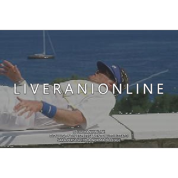 DIAP-RETROSPETTIVA ROGER MOORE ATTORE NELLA FOTO ROGER MOORE A MONTECARLO AL TORNEO DI TENNIS NELL\'ANNO 1988 AG ALDO LIVERANI SAS