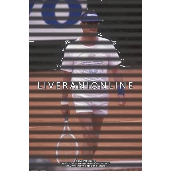 DIAP-RETROSPETTIVA ROGER MOORE ATTORE NELLA FOTO ROGER MOORE A MONTECARLO AL TORNEO DI TENNIS NELL\'ANNO 1988 AG ALDO LIVERANI SAS