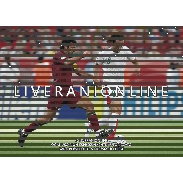 Portogallo - Iran mondiali germania 17/06/2006 nella foto Luis Figo con Ali Karimi copyright by firo sportphoto/ag. aldo liverani ONLY ITALY