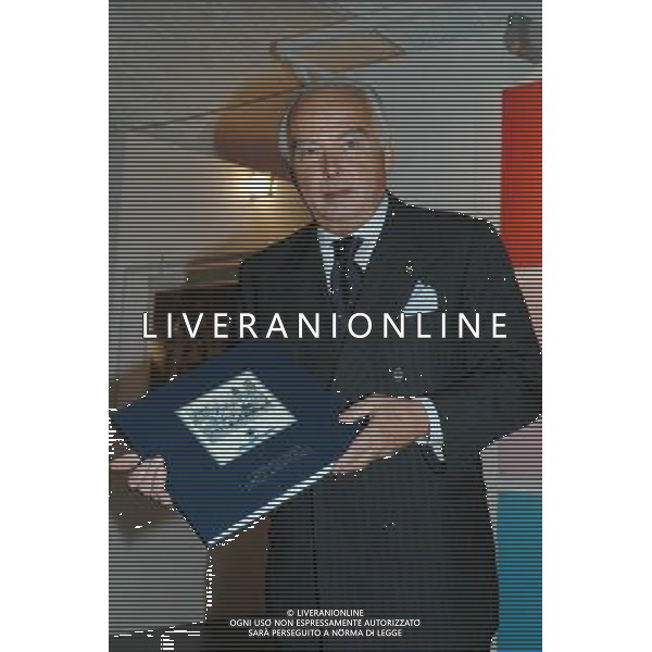 Genova, 15/06/06 Inaugurazione della mostra \'Semper uniti in gloria. I sessant\'anni della Sampdoria\' Nella foto: Il Presidente Riccardo Garrone mostra la pubblicazione \'I sessant\'anni della Sampdoria\' ph alessandro pintimalli / ag aldo