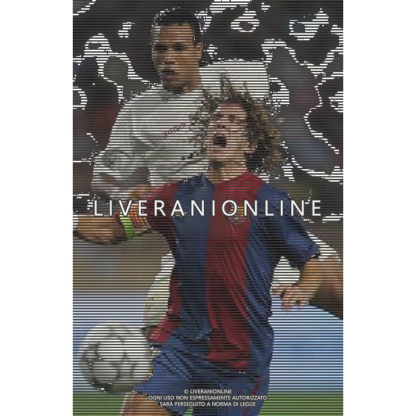 Barcellona - Siviglia Supercoppa Europea a Montecarlo 25/08/2006 nella foto puyol e luis fabiano ph luzzani/ag. aldo liverani