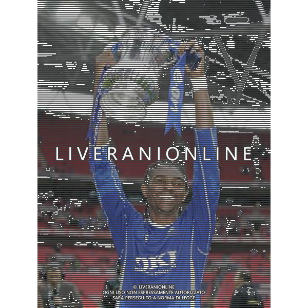 Portsmouth\'s Nigerian footballer Nwankwo Kano with the cup during celebrations , 0-1 , Cardiff City v Portsmouth, FA Cup Final, Wembley Stadium, London , Date 170508, Picture by Ian Kington mobile 07884001265, (IPS PHOTO AGENCY) - 21 Delisle road - London SE28 0JD- tel: 020 88 55 1 008 - fax: 020 88 55 1037 - ISDN: 020 88 55 1039 English Premier and Football League images are only to be used in an editorial context, images are not allowed to be published on another internet site unless a licence has been obtained from DataCo Ltd +44 207 864 9121. AG ALDO LIVERANI 