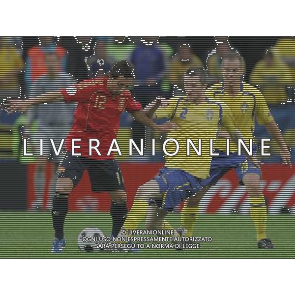 Innsbruck (AUT) 14-06-2008 Campionato europeoo calcio EURO2008 svezia-spagna 1:2 nella foto mikael nilsson e santi cazorla ph marco luzzani/ag aldo liverani s.p.a.