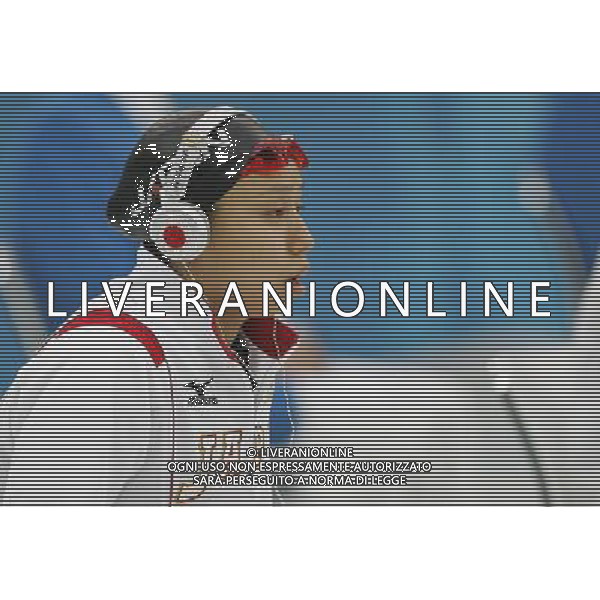 Pechino -08-2008 Giochi Olimpici Pechino Beijing 2008 finali nuoto nella foto un\' atleta japponese ascolta musica da cuffie stravaganti ph marco luzzani/ag aldo liverani s.a.s.