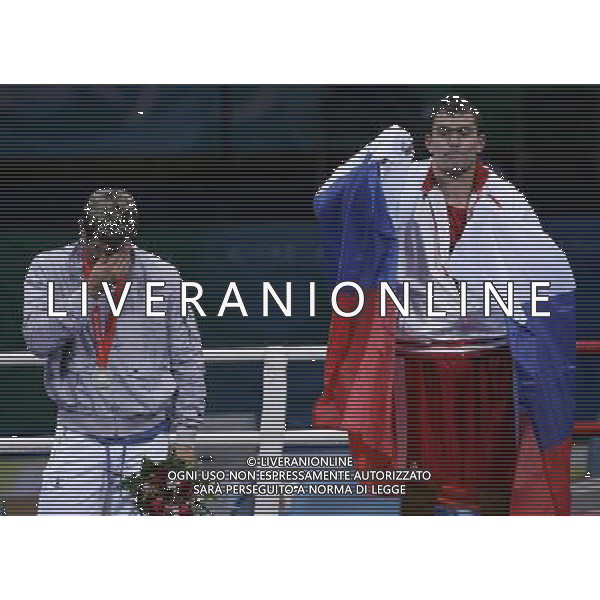 Pechino 23-08-2008 Giochi Olimpici Pechino Beijing 2008 boxe finale nella foto clemente russo (ITA) argento deluso sul podio e rakhim chakhkiev (Rus) oro ph marco luzzani/ag aldo liverani s.a.s.