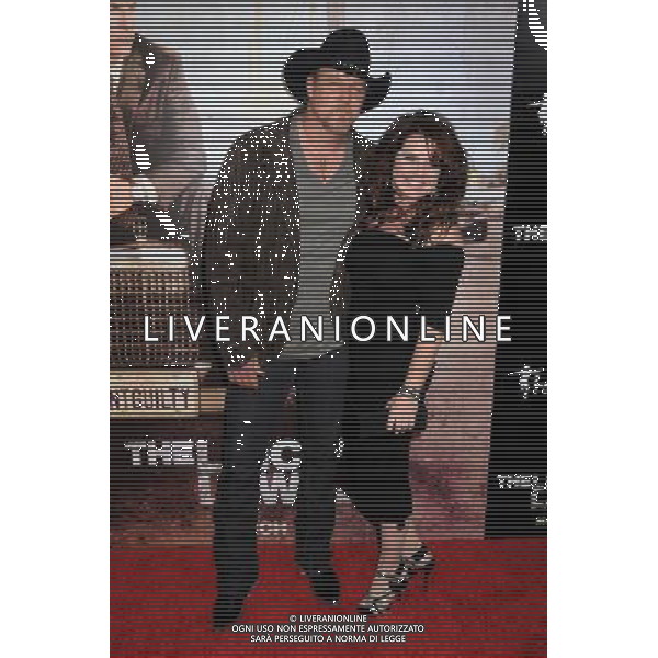 10 March 2011 - Hollywood, California - Trace Adkins and Rhonda Adkins. \'The Lincoln Lawyer\' Los Angeles Screening held at Arclight Cinemas. Photo Credit: Byron Purvis/AdMedia AG. ALDO LIVERANI SAS ITALY ONLY *** Local Caption *** .