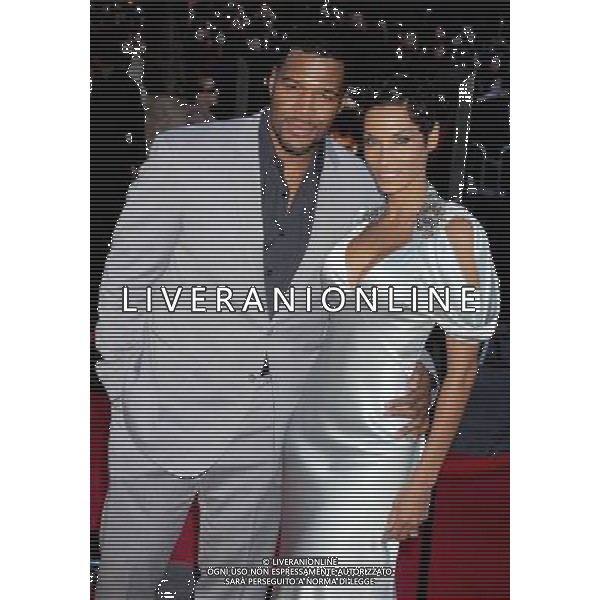  4/17/11 Michael Strahan and Nicole Murphy at the premiere of \'Water for Elephants\'. (Ziegfeld Theatre, NYC) AG. ALDO LIVERANI SAS ITALY ONLY *** Local Caption *** .