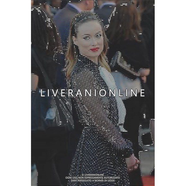 Olivia Wilde walks the red carpet at the Cowboys Vs Alien Premiere at the O2 Arena London - Image Copyright Ben Pruchnie Photographer B3968